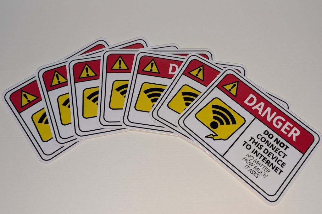Array of stickers all saying, "Danger Do Not Connect This Device to Internet, No Matter How Much It Asks